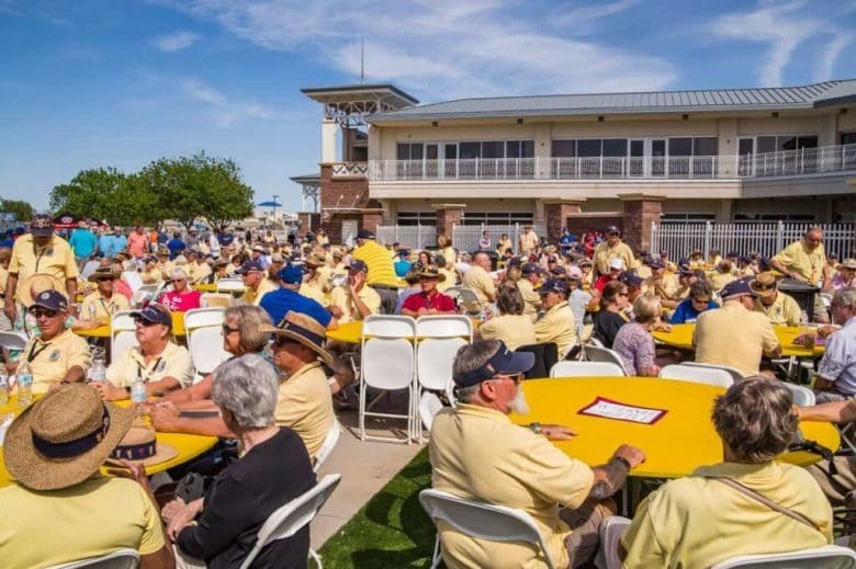 A large group of people sitting at tables.