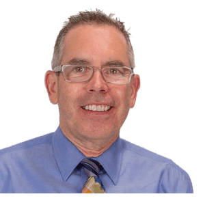 A man in a blue shirt and tie.